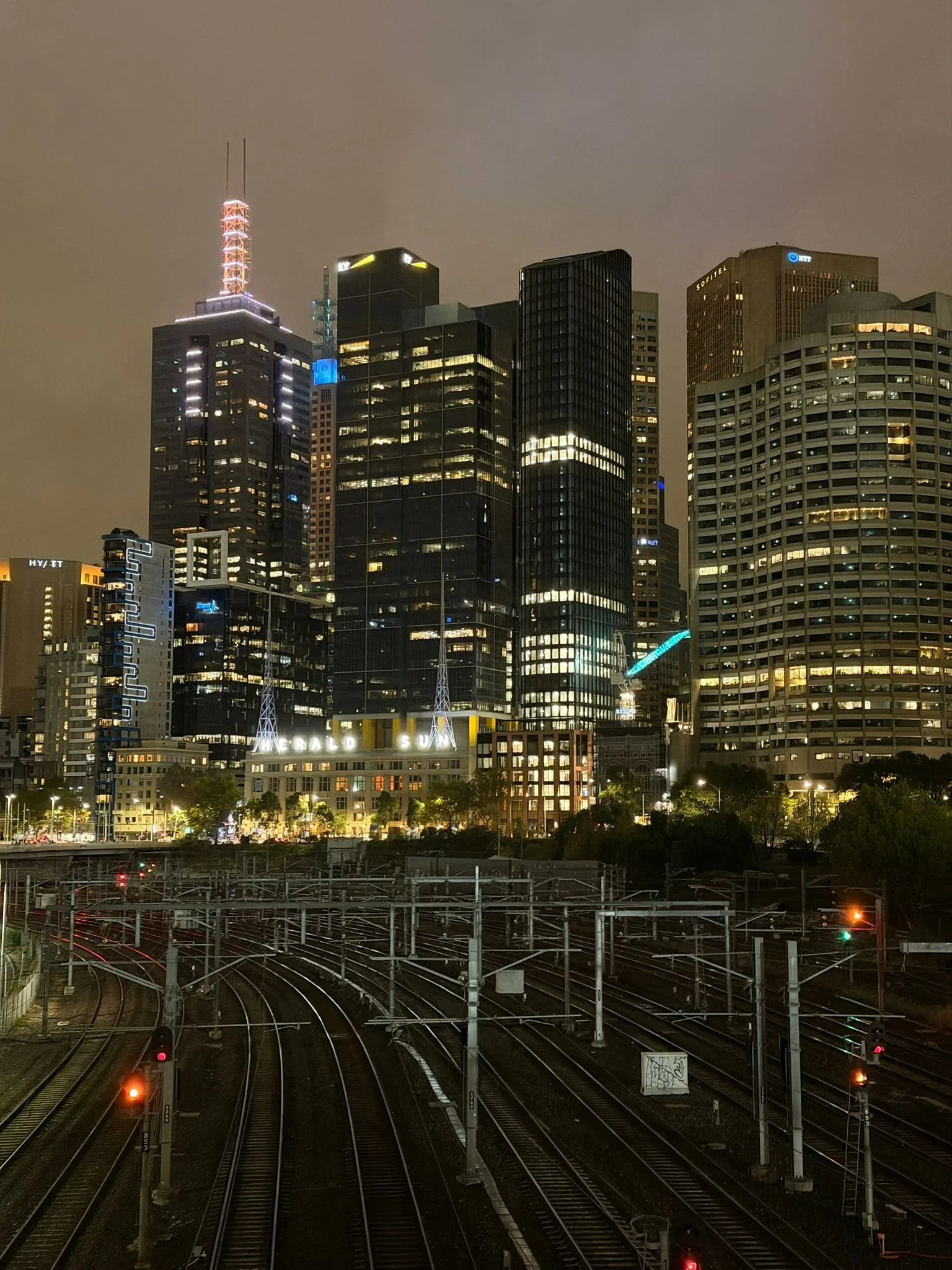 Melbourne CBD skyline at night, looking towards the city from across the rail yards